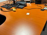 an image of a desk with two computers and a cell phone