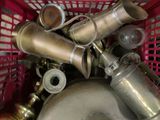 a red basket filled with different types of metal items