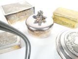a lot of silver items on a white table