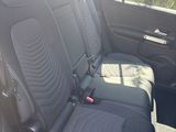 two seats in the back of a car that are black