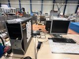 a desk with a computer, keyboard, mouse, and monitor on it