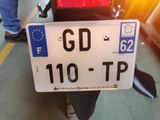 a motorcycle with a license plate on the back of it