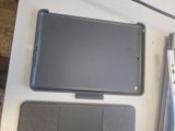 an image of a tablet computer sitting on top of a table next to a keyboard