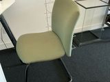 a chair that is sitting in front of a computer desk