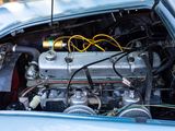 a blue car with a engine in the back of it