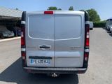 a silver van that is parked in a parking lot