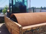 a picture of a construction vehicle that is parked in a lot