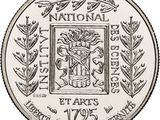 a close up of a coin with a picture of a coat of arms on it