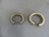 two pieces of metal that have been placed on a table