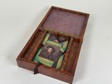 an image of a wooden box with a picture of a man in a hat