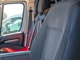 a view of the inside of a vehicle with the driver ' s seat down