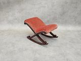 an image of a rocking chair with a red upholstered seat