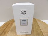 a white box sitting on top of a wooden table