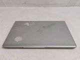 a laptop that is sitting on a white surface