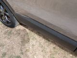 a close up of a car ' s side door with a sticker on it
