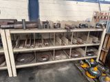 many different types of tools on the shelves in the garage