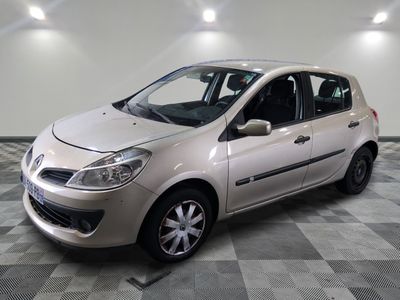 a picture of a small white car parked in a garage