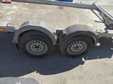 an image of a trailer with two tires on it