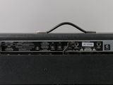 a close up of a guitar amp sitting on top of a table