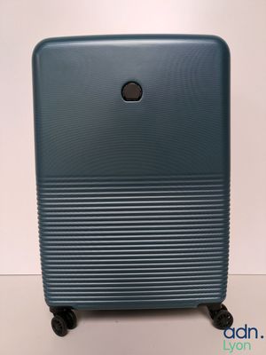 an image of a blue suitcase sitting on top of a table