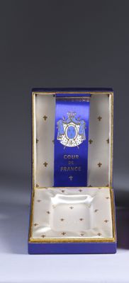 a small blue box with a blue ribbon and a small white box with a blue ribbon on it