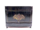 a black box with a gold decoration on it