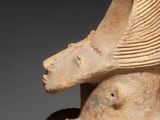 an image of a statue of a woman with a hat on her head