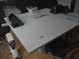 an image of a desk with a lot of papers on it