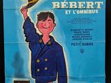 an old movie poster of a man holding a hat on top of a train