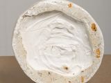 an image of a close up of a white object on a table