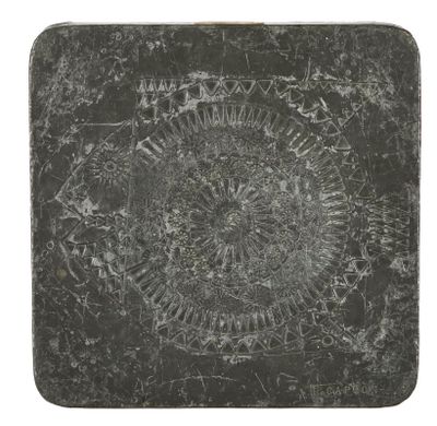 an image of a black and white photo of a stone coaster
