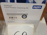 a picture of a hand holding a card printer cleaning kit