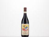 a bottle of red wine sitting on top of a table