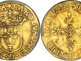 a gold coin with a crown on the front and a shield on the back