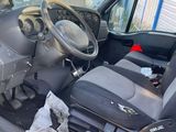 a picture of the inside of a car with the driver ' s seat down