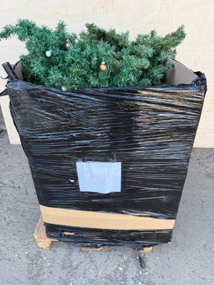 a black bag with a christmas tree inside of it