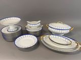 a lot of plates and bowls that are on the table