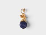 a gold - plated charm with a blue bead and an angel
