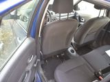 a blue car with a black seat belt and a black seat belt