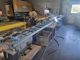 a picture of a machine that is working on a piece of metal