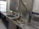 a kitchen with stainless steel counter tops and stainless steel appliances