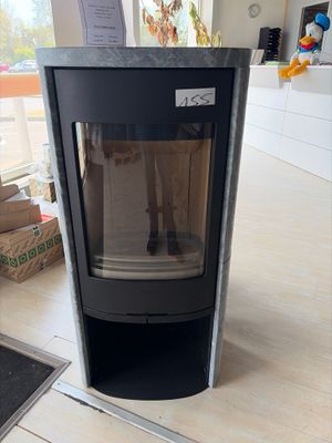 a black stove sitting on the floor in a room