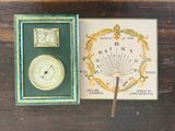 a box with a clock inside of it on a table