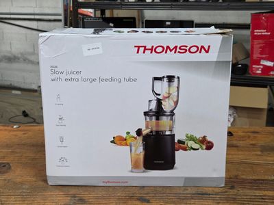 a box that has a blender in it on a table