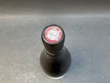 a bottle of beer sitting on top of a counter