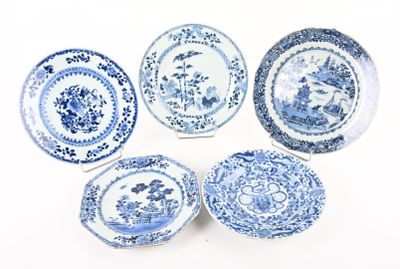 six blue and white plates with designs on them on a white surface