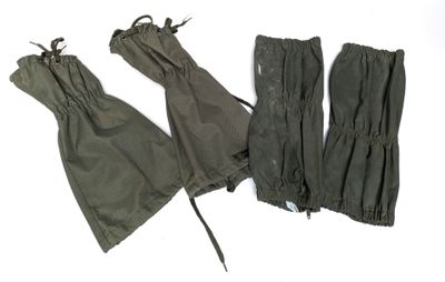 three pairs of military gaiters on a white background