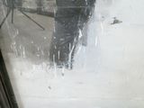 a man that is standing in the rain with an umbrella