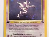 a close up of a pokemon card on a white surface