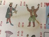 a picture of a card game with a picture of people playing cards